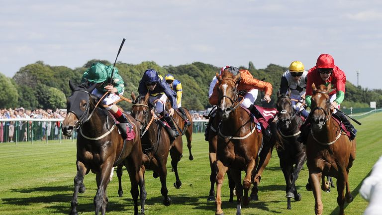 Aljazzi ridden by Andrea Atzeni (left) comes out on top in a bunch finish the Betfred TV/EBF Stallions Dick Hern Fillies' Stakes at Haydock.