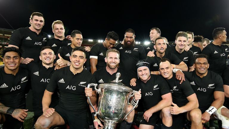 The All Blacks celebrate with the Bledisloe Cup after beating the Wallabies