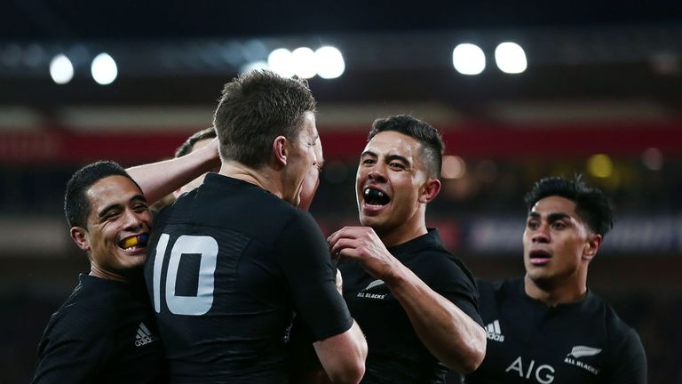 Anton Lienert-Brown and Beauden Barrett of New Zealand rush in to celebrate Israel Dagg's try against the Wallabies in Wellington, 27 August 2016.