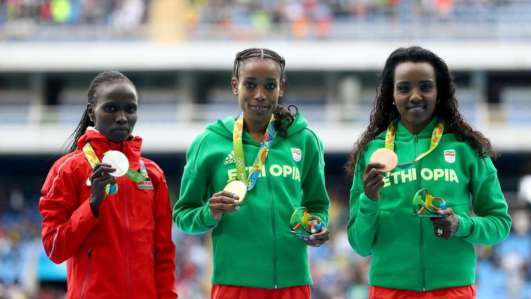 RIO DE JANEIRO, BRAZIL - AUGUST 12:  Almaz Ayana of Ethiopia, gold medal, Vivian Jepkemoi Cheruiyot of Kenya, silver medal, and Tirunesh Dibaba of Ethiopia