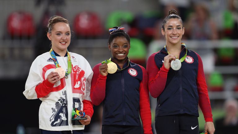 Great Britain's Amy Tinkler celebrates a bronze with   Simone Biles and Aly Raisman 