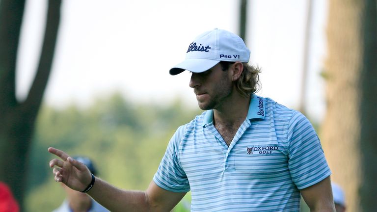 SILVIS, IL - AUGUST 11:  Andrew Loupe acknowledges the crowd on the ninth hole during the first round of the John Deere Classic at TPC Deere Run on August 
