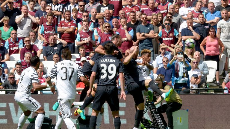 LONDON, ENGLAND - AUGUST 07:  Andy Carroll of West Ham United heads home his second goal 