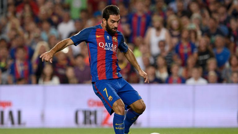 Barcelona's Turkish midfielder Arda Turan scores during the second leg of the Spanish Supercup football match between FC Barcelona and Sevilla FC at the Ca