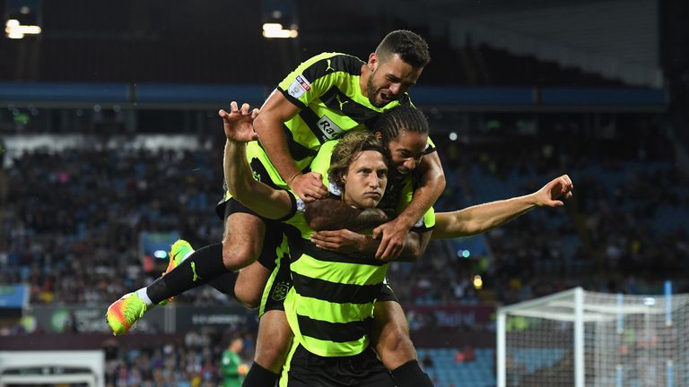 BIRMINGHAM, ENGLAND - AUGUST 16:  Michael Hefele of Huddersfield Town celebrates with team mates after scoring his sides first goal during the Sky Bet Cham