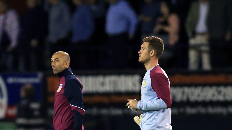 Aston Villa manager Roberto Di Matteo (left) appears dejected after the EFL Cup defeat at Luton