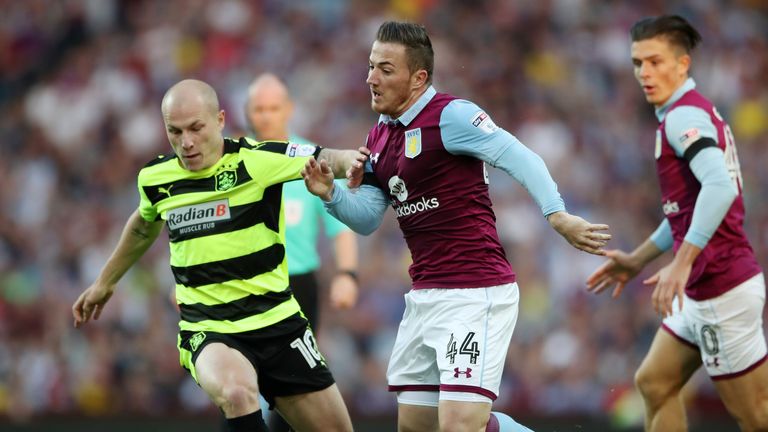 Aston Villa's Ross McCormack and Huddersfield Town's Aaron Mooy battle for the ball