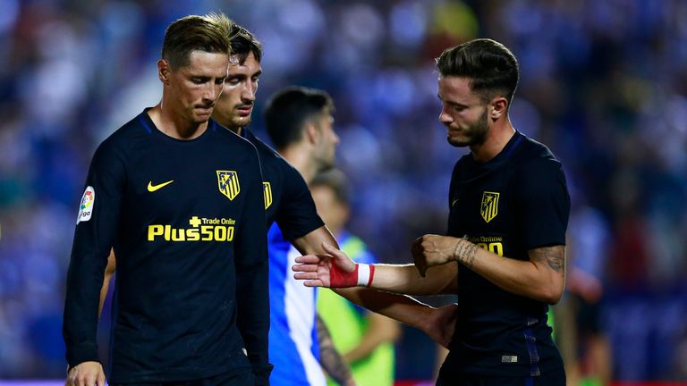 LEGANES, SPAIN - AUGUST 27: Fernando Torres (L) of Atletico de Madrid walks with his teammates  Stefan Savic (2ndR) and Saul Niguez (R) after the La Liga m