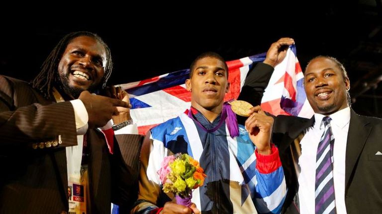 Gold medalist Anthony Joshua (C) , Audley Harrosn (L) and Lennox Lewis (R)