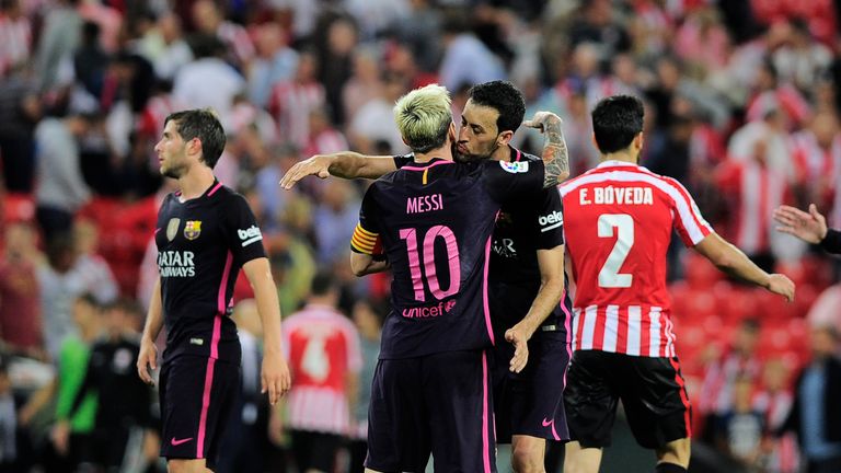 Barcelona's Lionel Messi and Sergio Busquets celebrate their 1-0 victory 