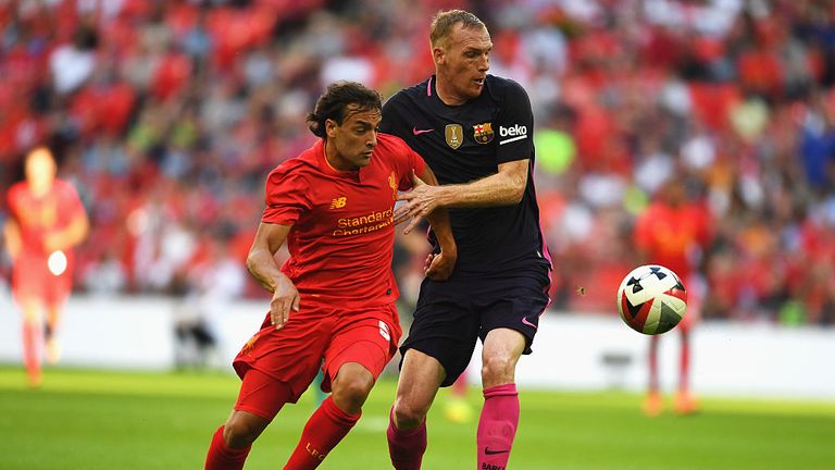  Jeremy Mathieu of Barcelona and Lazar Markovic of Liverpool in action 