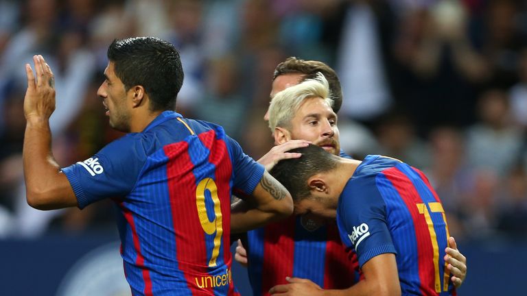 Munir is congratulated by Lionel Messi and Luis Suarez