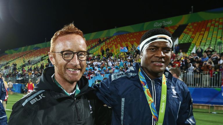 Fiji head coach Ben Ryan (R) celebrates with  Ro Dakuwaqa after the medal ceremony