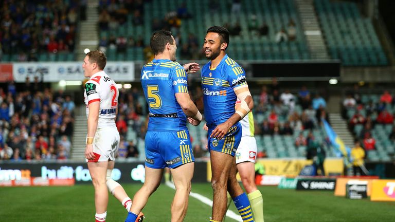 Bevan French of the Eels celebrates one of his tries with team mates during the round 25 NRL match between Parramatta and St George Illawarra Dragons