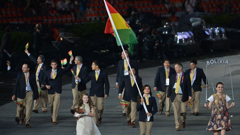 Bolivia's flagbearer Karen Milenka Torrez Guzman (C) leads her delegation during the opening ceremony of the London 2012 Olympic Games 