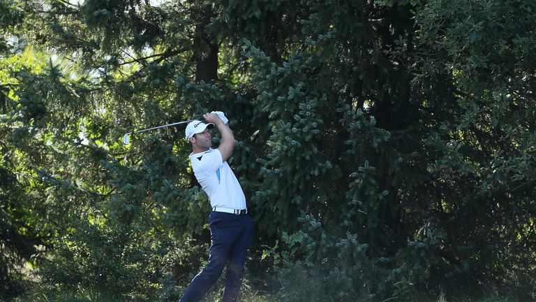 Dredge escaped with a bogey at 18 after his drive almost disappeared into the trees