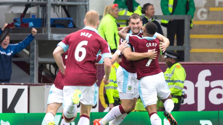 Sam Vokes (2nd R) celebrates with teammates after scoring the opening goal of the game