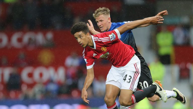 Cameron Borthwick-Jackson of Manchester United in action with Matt Ritchie of AFC Bournemouth
