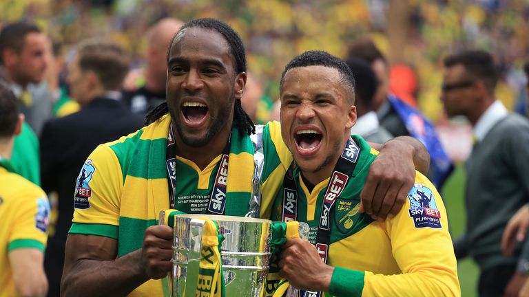 Norwich City's Cameron Jerome and Martin Olsson celebrate victory in the 2014/15 Championship play-off final