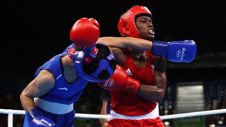 Nicola Adams (R) of Great Britain fights against Cancan Ren of China during a Women's Fly (48-51kg) Semifinal bout 