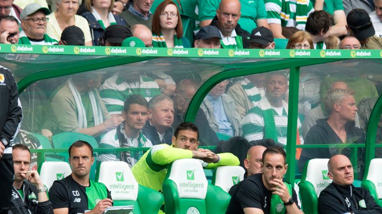 Celtic goalkeeper Craig Gordon takes his seat on the bench
