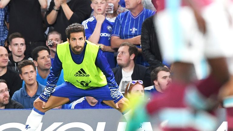 Cesc Fabregas looks on from the sidelines at Stamford Bridge