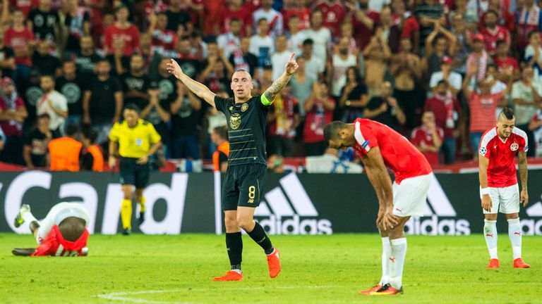 Celtic captain Scott Brown celebrates at full-time after progressing to the group stages of the Champions League