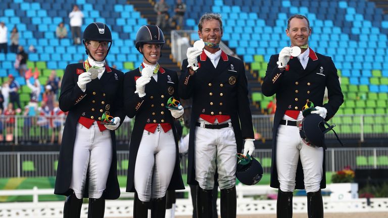 RIO DE JANEIRO, BRAZIL - AUGUST 12:  (L-R) Fiona Bigwood, Charlotte Dujardin, Carl Hester and Spencer Wilton of Great Britain who won the team silver medal