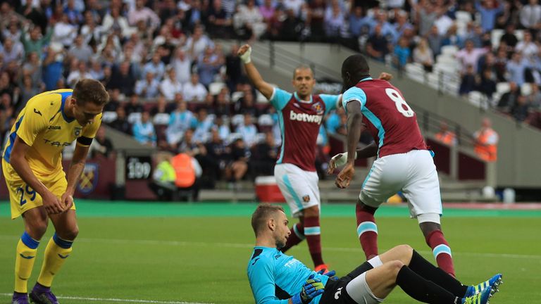 West Ham United's Cheikhou Kouyate (right) celebrates scoring his side's first goal against Domzale