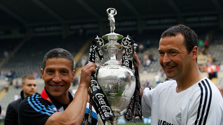 NEWCASTLE UPON TYNE, ENGLAND - APRIL 24:  Newcastle manager Chris Hughton (l) and his assistant Colin Calderwood lift the trophy as Newcastle are crowned c