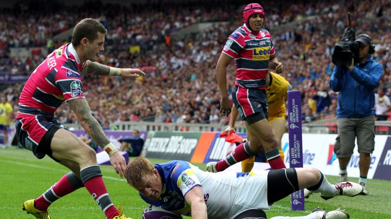 LONDON, ENGLAND - AUGUST 25:   Chris Riley of Warrington Wolves goes over for his try during the Carnegie Challenge Cup Final between Leeds Rhinos and Warr
