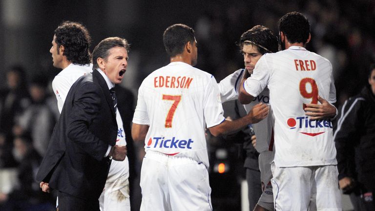 Lyon's coach Claude Puel congratulates his players after they scored a goal during the French L1 football match Lyon vs. Lille, on October 18, 2008 