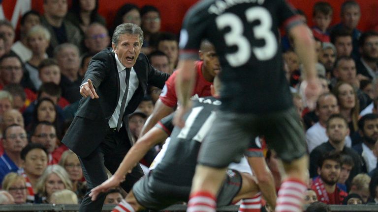 Southampton's French manager Claude Puel (L) gestures on the touchline during the English Premier League football match between Manchester United and South