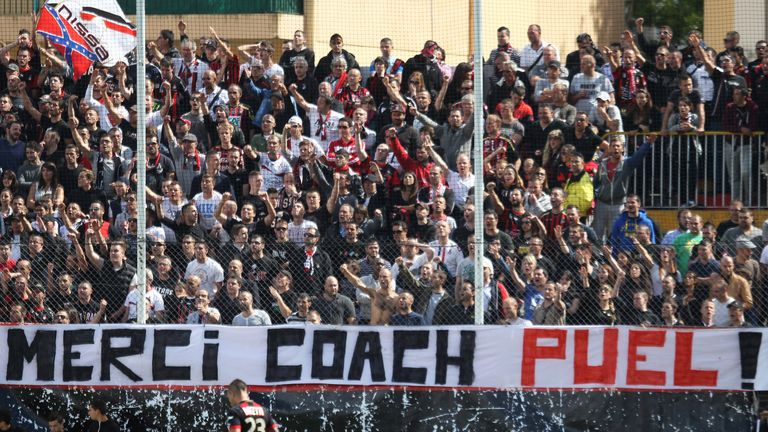 Nice's supporters cheer behind a banner showing their gratitude to coach Claude Puel during a game against Lyon in May 2013