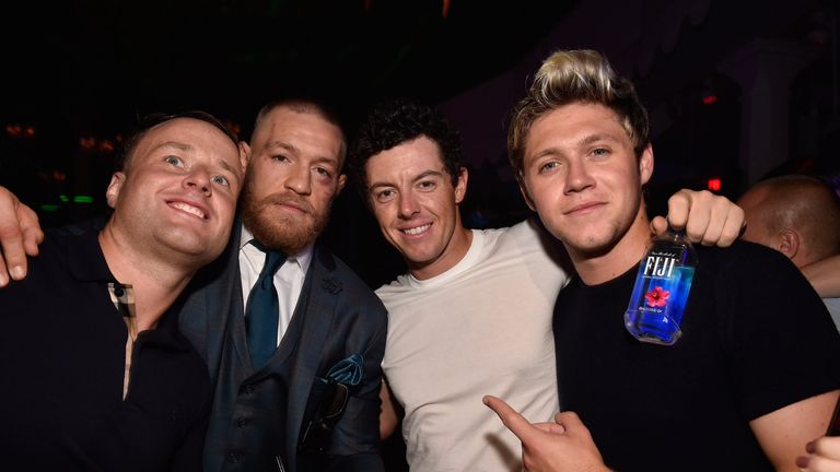 LAS VEGAS, NV - AUGUST 20:  Mixed martial artist Conor McGregor (2nd L) and singer Niall Horan (R) celebrate McGregor's UFC 202 victory during the official