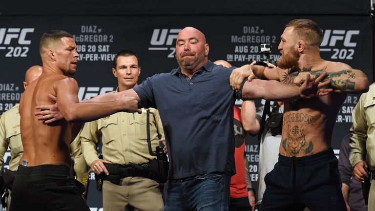 LAS VEGAS, NV - AUGUST 19:  UFC President Dana White (C) separates mixed martial artist Nate Diaz (L) and UFC featherweight champion Conor McGregor (R) as 