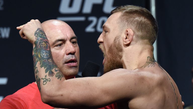 LAS VEGAS, NV - AUGUST 19:  Commentator Joe Rogan (L) interviews UFC featherweight champion Conor McGregor during his weigh-in for UFC 202 at MGM Grand Con