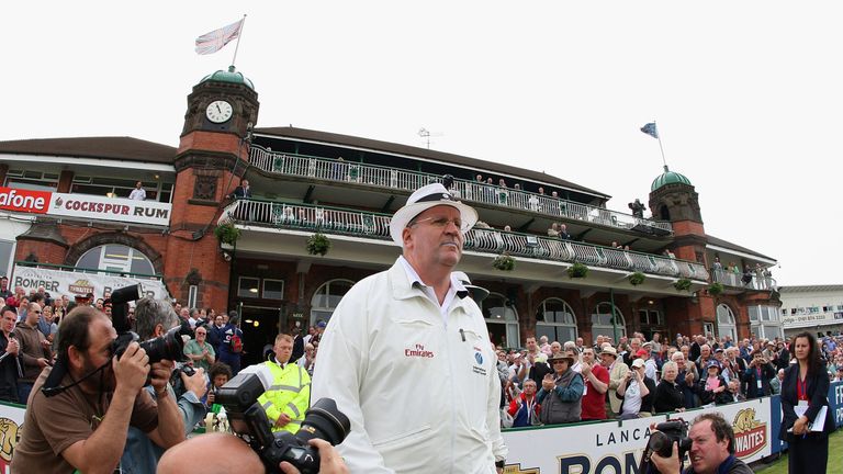 Umpire Darrell Hair, returning to Test cricket , enters the field for the start of play