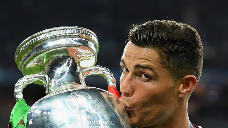 PARIS, FRANCE - JULY 10:  Cristiano Ronaldo of Portugal kisses the Henri Delaunay trophy to celebrate after their 1-0 win against France in the UEFA EURO 2