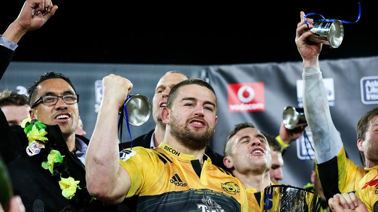 Dane Coles (C) of the Hurricanes celebrates the team's victory after the Super Rugby final between the Wellington Hurricanes and Lions of South Africa