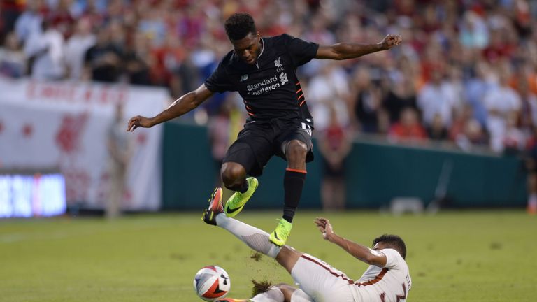 Daniel Sturridge avoids a slide tackle by Roma defender Emerson (33) during their friendly soccer match at Busch Stadium in St