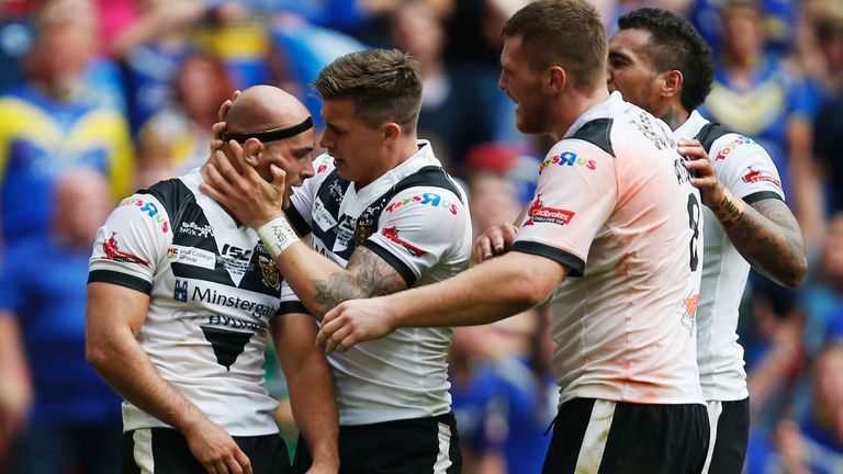 Danny Houghton (left) of Hull FC is congratulated after preventing a try during the Ladbrokes Challenge Cup Final