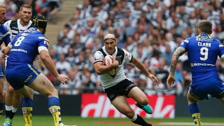 Danny Houghton of Hull FC runs with the ball against Warrington 