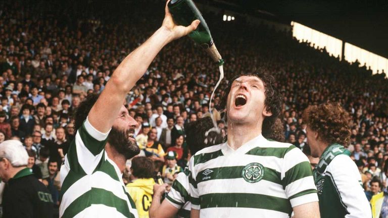 Danny McGrain (left) 'gives' Roy Aitken some champagne to celebrate winning the title in 1982