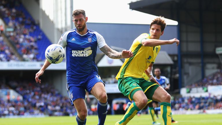 Daryl Murphy of Ipswich Town is closed down by Timm Klose of Norwich City during the Sky Bet Championship match