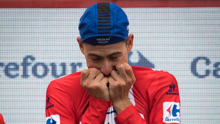 David de la Cruz celebrates on the podium after winning the red jersey during the 9th stage of the 71st edition of the Vuelta a Espana