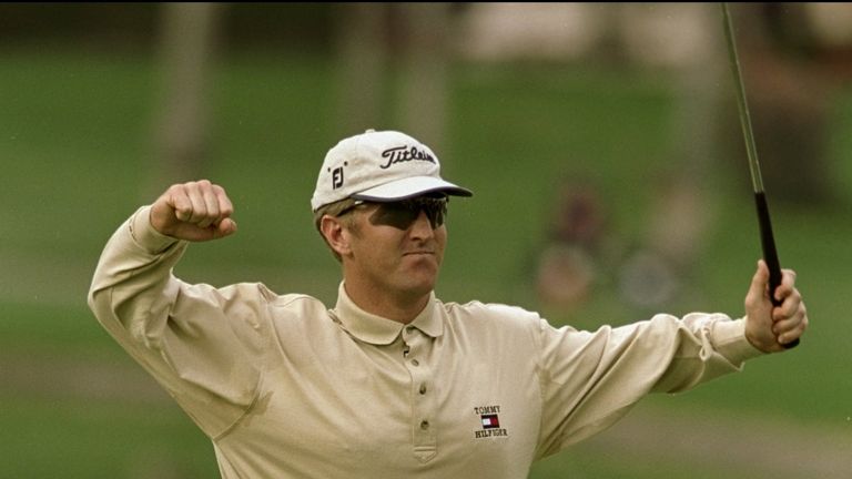 David Duval celebrates after holing his eagle putt for a 59 in California