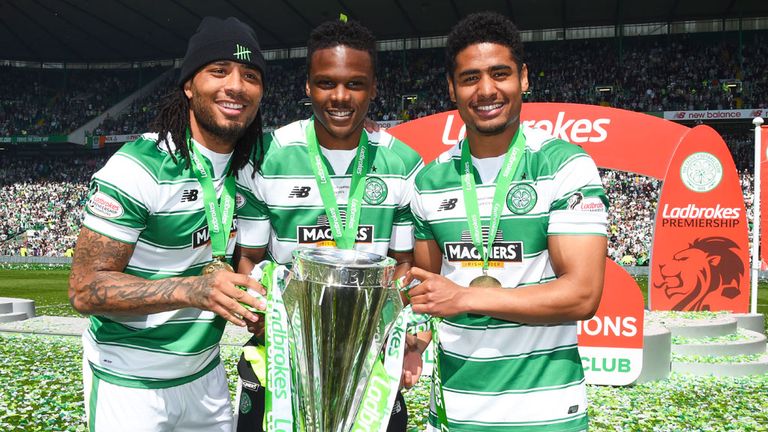 Dedryck Boyata (centre) with Colin Kazim-Richards, Saidy Janko (22) and the Premiership trophy