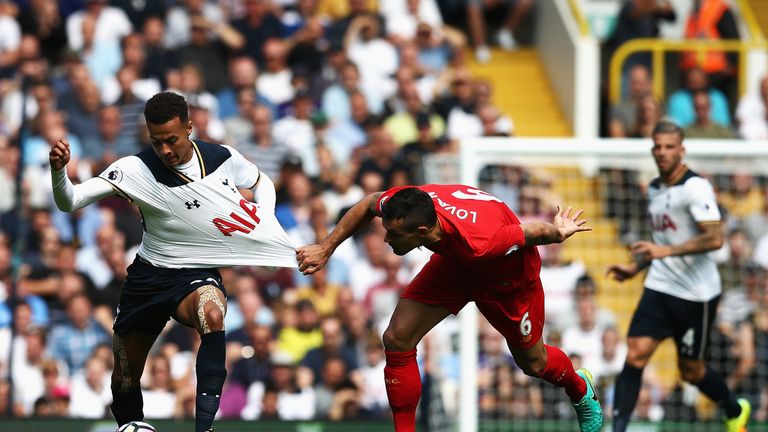 Dejan Lovren of Liverpool pulls back Dele Alli during the Premier League clash at White Hart Lane