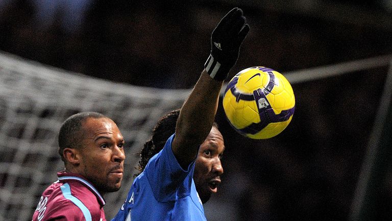 Chelsea's Didier Drogba (R) vies with West Ham's Danny Gabbidon (L) during their Premiership match at home to West Ham at Upton Park football Boleyn Ground